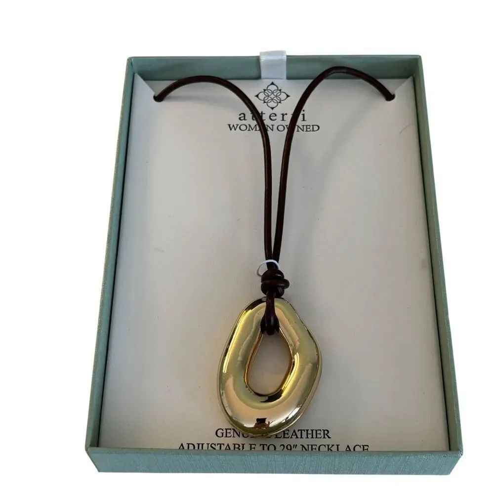 Sleek Gold Tone Pendant Necklace on Adjustable Brown Leather Cord.